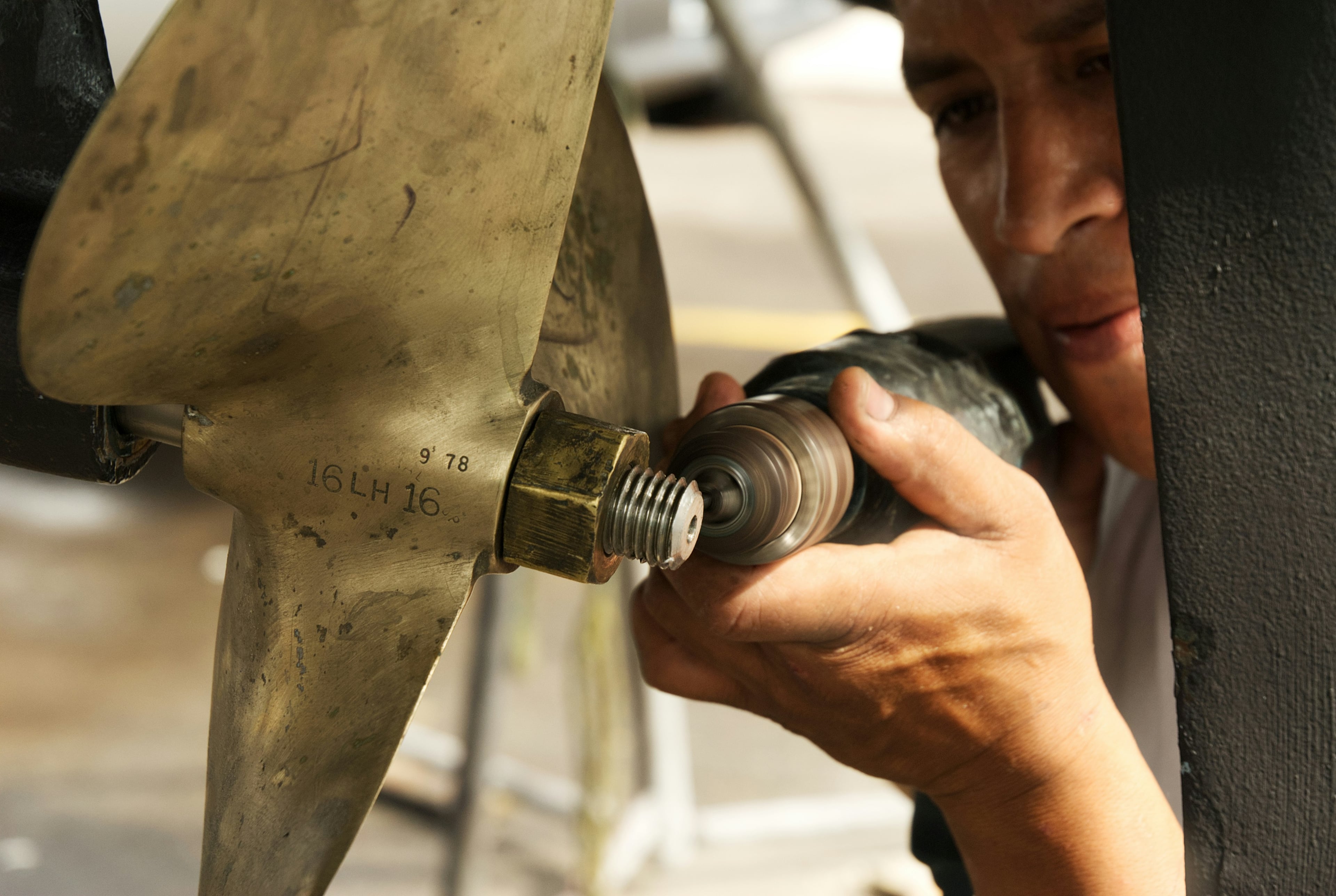 Marine mechanic working on a propeller